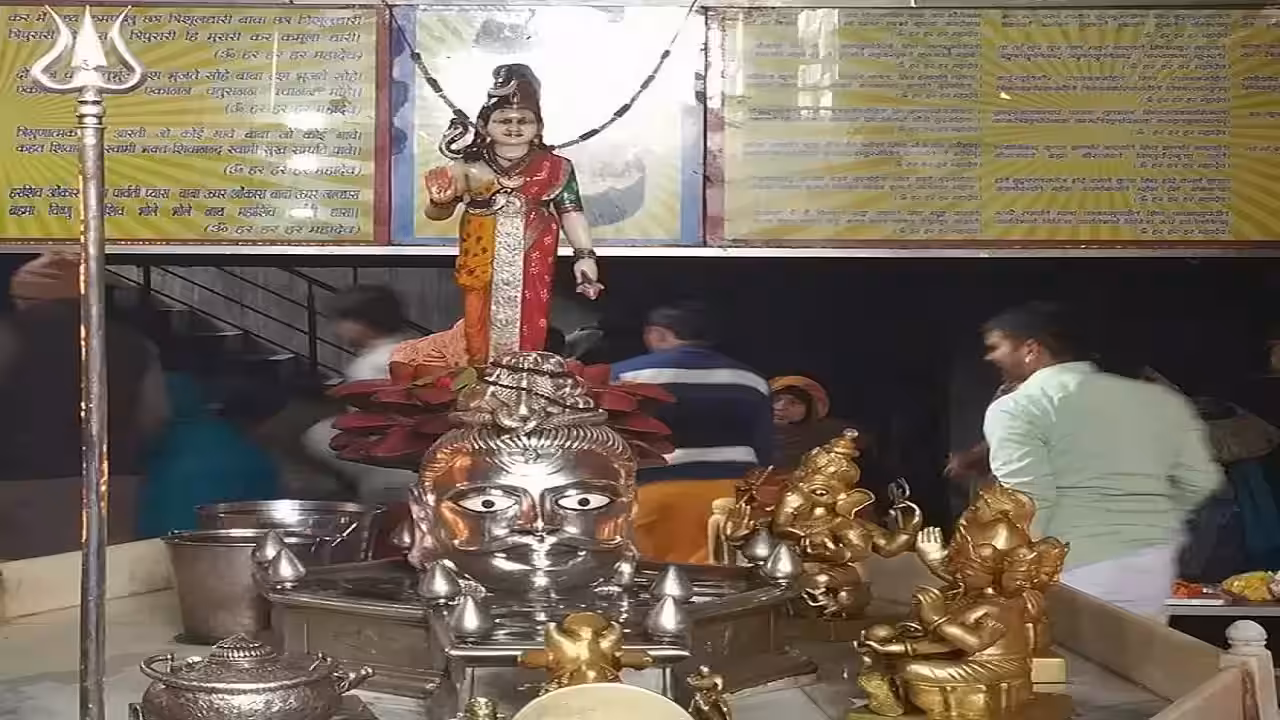 The silver mukhalinga in the sanctum, flanked by brass idols of the Shiva family beneath a murti of Parvati